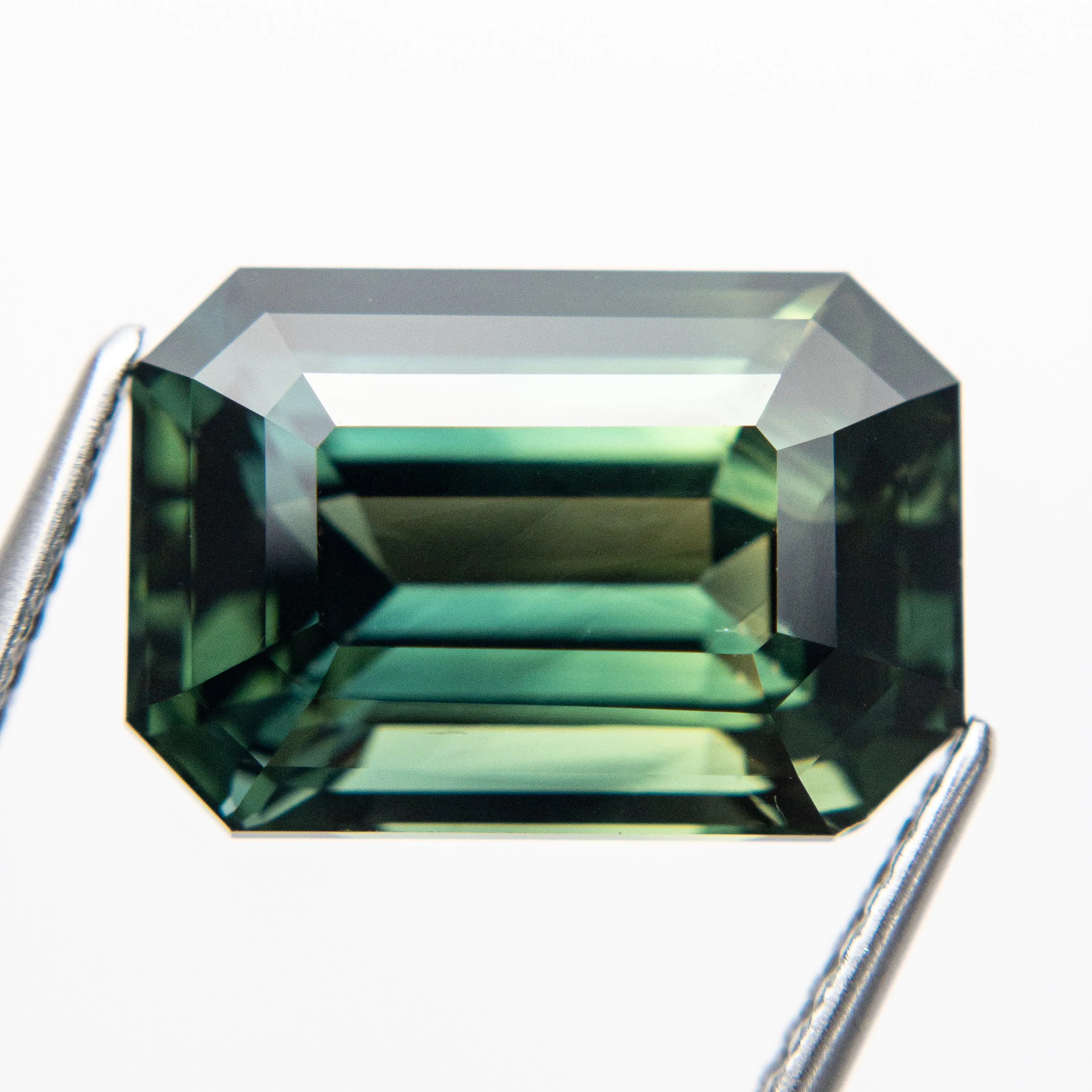 10.60ct 14.13x9.70x7.56mm Cut Corner Rectangle Step Cut Sapphire 18972-01