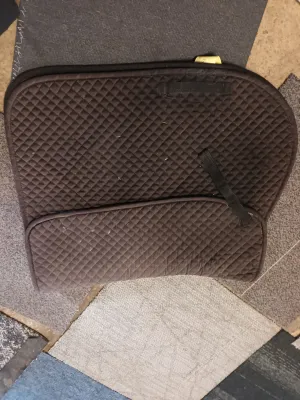 Full size, requisite saddle pad with shim pockets