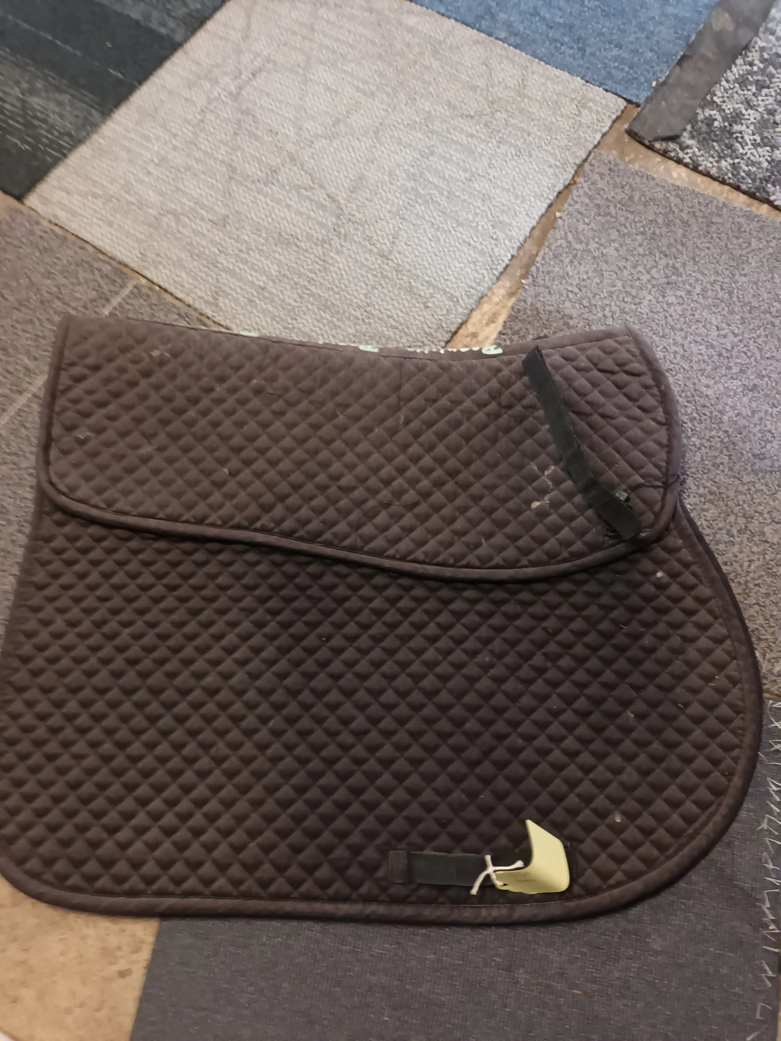 Full size, requisite saddle pad with shim pockets