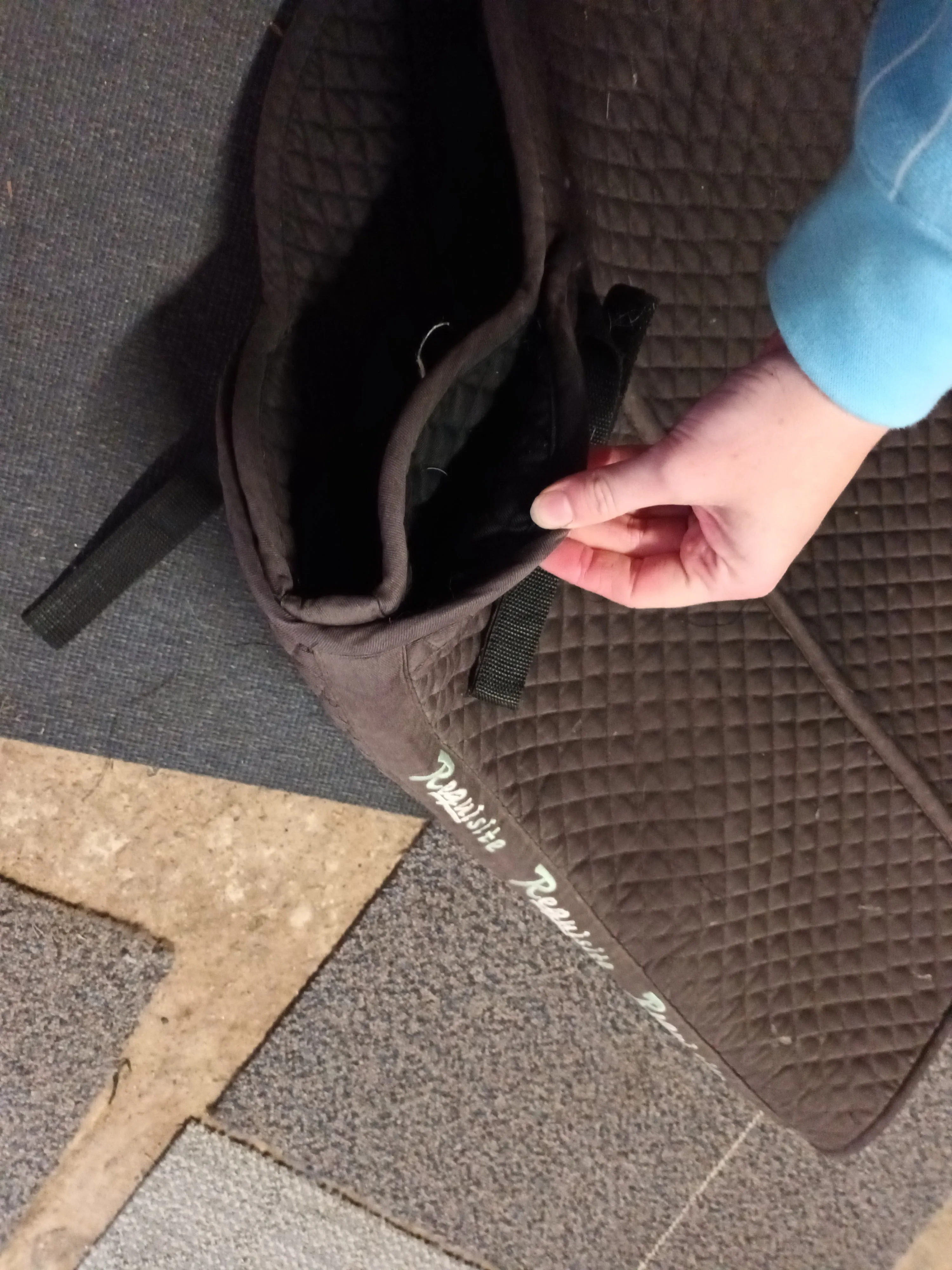 Full size, requisite saddle pad with shim pockets